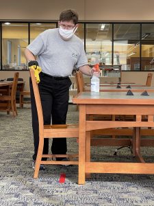 keith cleaning a seating area