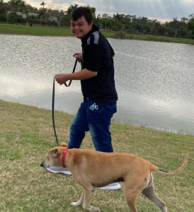 Marc walking dog around lake