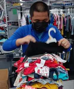 Joshua folding clothing