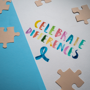Celebrate Differences multicolor text with puzzle pieces around it